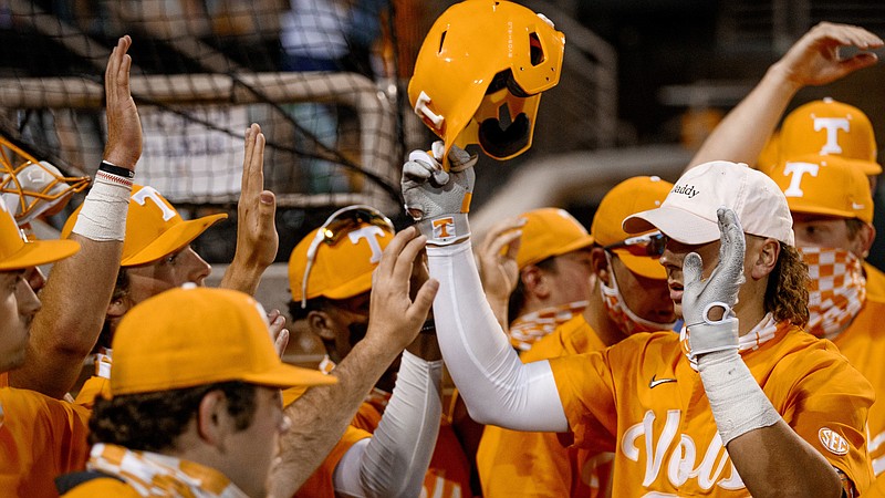 Tennessee Athletics photo by Kate Luffman / Tennessee outfielder Jordan Beck raises his helmet to celebrate with teammates during last season's 50-18 run that culminated in the College World Series.