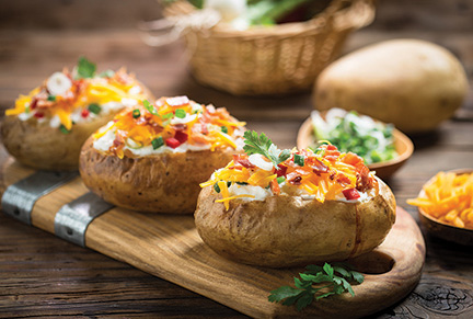 Getty Images / Baked potatoes with cheese and bacon