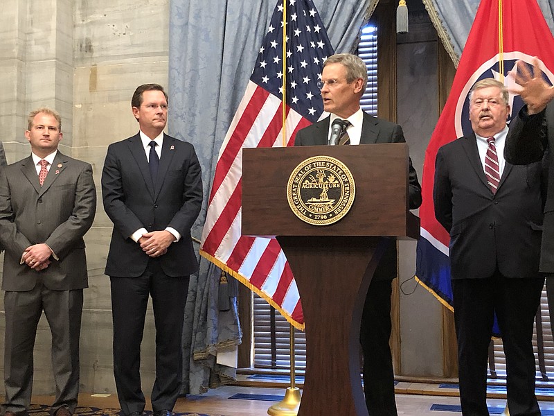 Gov. Bill Lee, flanked by House Speaker Cameron Sexton (left) and Lt. Gov. Randy McNally (right), speaks to reporters during a Tennessee Capitol news conference Oct. 20, 2021, following a special legislative session on Ford Motor Co. incentives for new plant in Tennessee. (Photo by Andy Sher/Times Free Press)