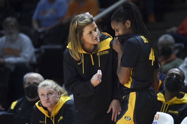 Missouri women's basketball coach Robin Pingeton talks with guard Mama Dembele (4) during an NCAA college basketball game against Tennessee, Thursday, Feb. 10, 2022 in Knoxville, Tenn.(Saul Young/Knoxville News Sentinel via AP)