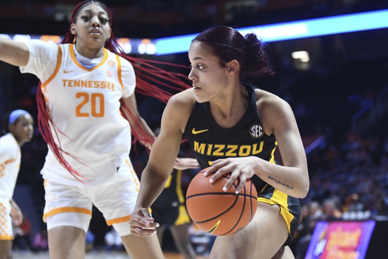 Missouri forward Kiya Dorroh (24) drives to the basket defended by Tennessee's Tamari Key (20) during an NCAA college basketball game, Thursday, Feb. 10, 2022 in Knoxville, Tenn.(Saul Young/Knoxville News Sentinel via AP)