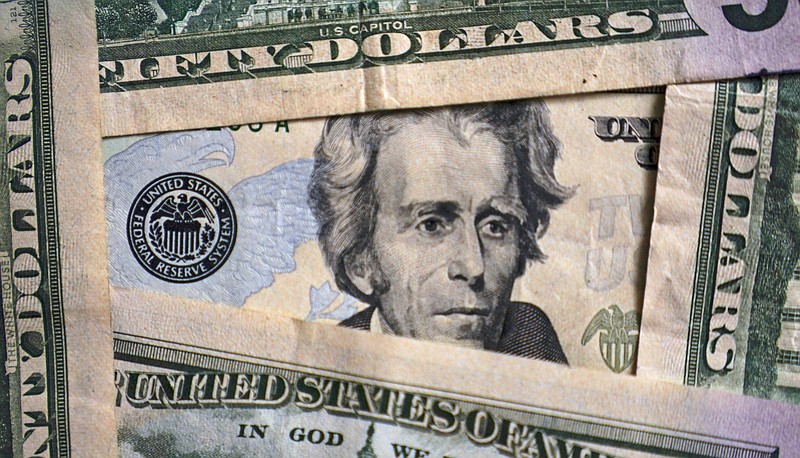 FILE - Photo of Andrew Jackson on a $20 bill is shown, Friday, Jan. 28, 2022, in Cleveland. Worrying about overall financial issues can make people less likely to plan for retirement, according to a 2021 report. If you don't have enough saved for your golden years, it could mean retiring later than you planned or running out of money during retirement. (AP Photo/Tony Dejak, File)