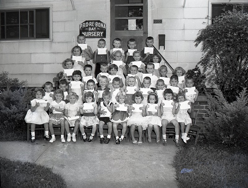 In late August of 1959 these graduates of the Pro Re Bona Day Nursery Vacation Bible School were photographed outside the nursery in East Chattanooga. They are, front row, left to right, Sheron Nolan, Debra Lewis, Denine Taylor, Jo Williams, Mark Bennett, Beverly Gentry, Debra Gilley, Sandra Bettis, Carmen Hale and Bridgett Ballew. Second row: Keith Alley, Mark Hale, Sherry Hale, Joel Walker, Michael Taylor, Johnathan Walker, Kenneth Byrd, Gary Farrell, Stanley Segers, Danny Ware and David Goodner. Third row: Diane May, Anthony Hullender, Ricky Burris, Rebecca Gainer, Randy Bearfield, Richard May, Mike Bennett and Viva Williams. Fourth row: Janet Clingam, Elaine Stoner, Jennifer Segors and Brenda Broadrick. Back row: Walter Row, Johnny Miller, Mike Walker, Stanley Ray and Bruce Broadrick. Photo from Chattanooga News-Free Press archives.