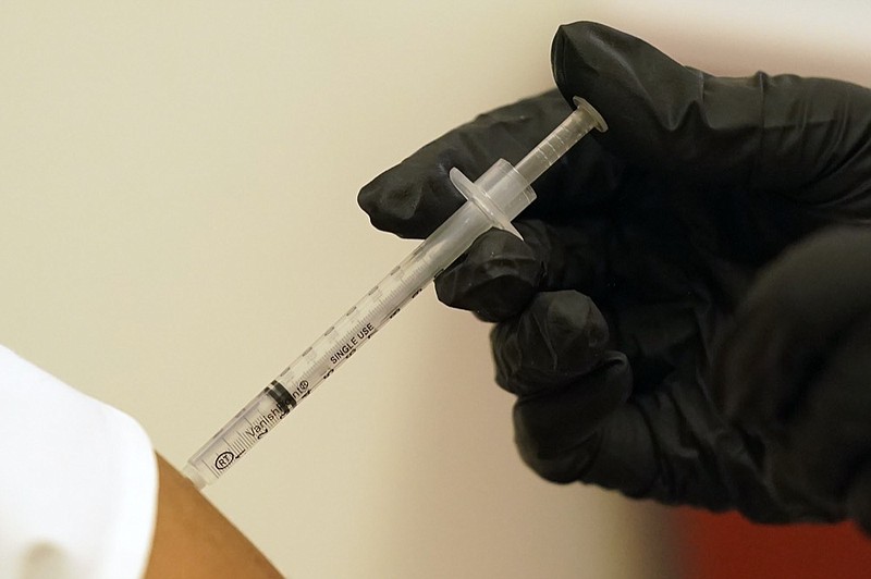 A person is injected with her second dose of the Pfizer COVID-19 vaccine at a Dallas County Health and Human Services vaccination site in Dallas, Thursday, Aug. 26, 2021. (AP Photo/LM Otero, File)


