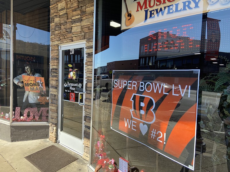 Staff Photo by Stephen Hargis / The storefront at Patterson's Music & Jewelry on Gault Avenue North celebrates the Super Bowl and Evan "Money Mac" McPherson on Wednesday, Feb. 8, 2022.