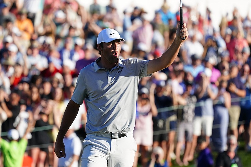 AP photo by Ross D. Franklin / Scottie Scheffler shouts as he celebrates his birdie putt on the third playoff hole Sunday evening at the Phoenix Open. Scheffler beat Ryder Cup teammate Patrick Cantlay to earn the first victory of his PGA Tour career.