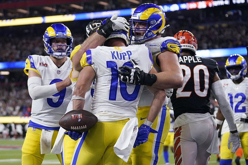 AP photo by Marcio Jose Sanchez / Los Angeles Rams wide receiver Cooper Kupp is congratulated by teammates after scoring a go-ahead touchdown against the Cincinnati Bengals at Super Bowl LVI on Sunday night in Inglewood, Calif.