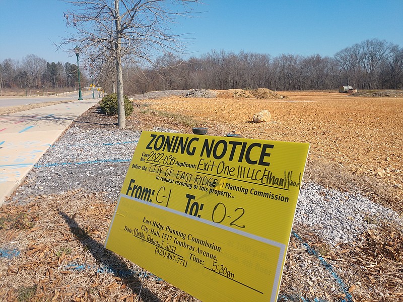 Staff photo by Mike Pare / A zoning sign sits in front of a tract that could hold a facilty to provide emergency medical services on Camp Jordan Parkway.