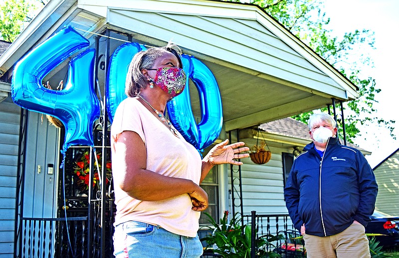 Staff File Photo / Homeowner Eleanor Young talks about how the Home Uplift program has cut her monthly electric bill and improved her family's quality of life. She was the 400th recipient of the energy efficiency help from EPB and TVA in 2020, and since then, EPB has increased the total number of Home Uplift participants in Chattanooga to 525.