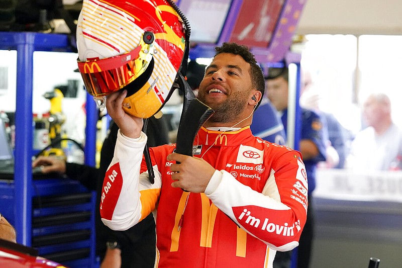 AP photo by John Raoux / Bubba Wallace puts on his helmet as he prepares for a NASCAR Cup Series practice at Daytona International Speedway on Tuesday in Daytona Beach, Fla.