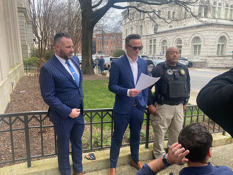 Staff photo by Barry Courter / Blue Light club co-owner Brian Joyce is flanked by his attorney Scott Maucere, left, and head of security Kenneth Clack during a news conference Joyce called following his hearing before the Chattanooga Beer & Wrecker Board on Thursday.