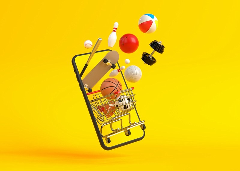 Online shopping concept on smartphone on yellow background. Online shopping sports equipment. 3d rendering sports tile / Getty Images
