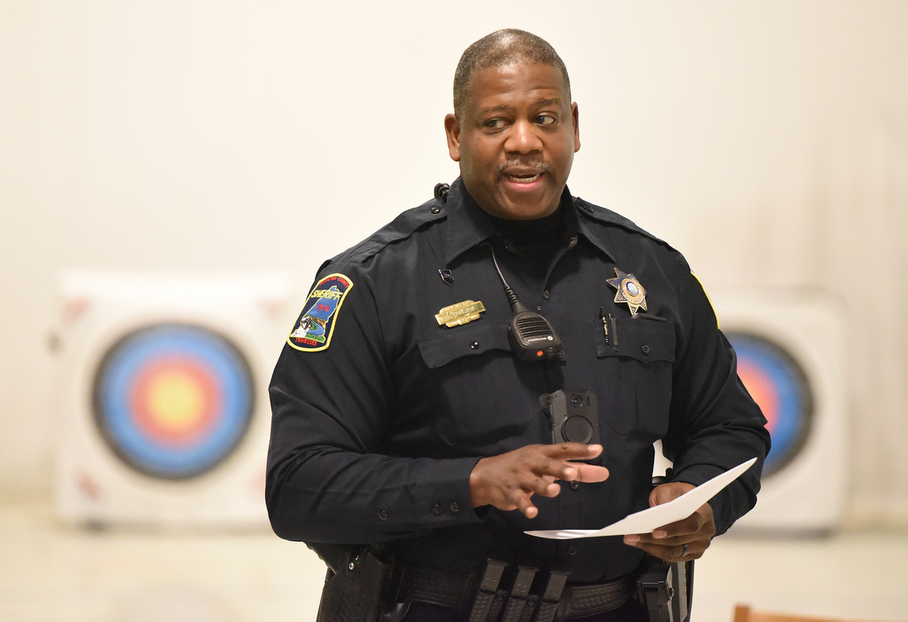Staff Photo by Matt Hamilton / School resource officer Mike Houston talks to students about an upcoming competition as he teaches archery at Lofts Middle School in Hixson on Thursday, February 17, 2022.