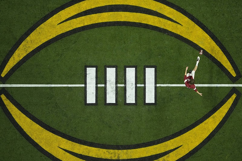 AP photo by Charlie Riedel / Alabama punter James Burnip warms up before the College Football Playoff national championship game against Georgia on Jan. 10 in Indianapolis.