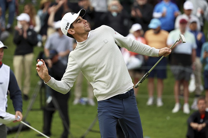 AP photo by Ryan Kang / Joaquin Niemann throws his golf ball into the crowd at Riviera Country Club after winning the Genesis Invitational on Sunday in Los Angeles. Niemann set the tournament's scoring records for 18, 36 and 54 holes before closing out a wire-to-wire win by two strokes.