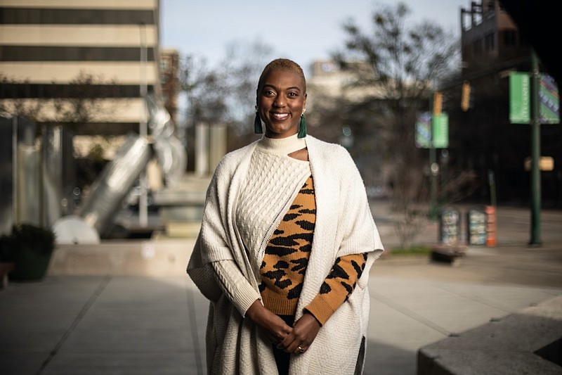 Staff photo by Troy Stolt / Erika Burnett poses for a portrait outside of the Chattanooga Public Library on Monday, Dec. 20, 2021 in Chattanooga, Tenn.