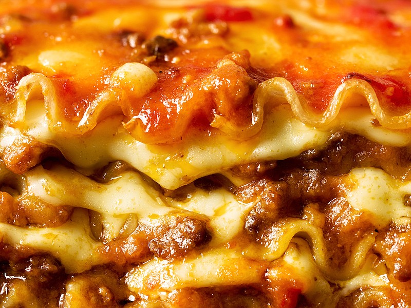 Rustic Italian cheesy lasagna pasta. / Getty Images/iStock/zkruger