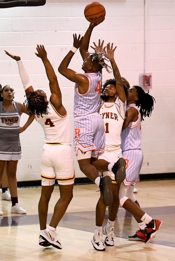 Staff Photo by Robin Rudd / Brainerd's Jakyse Locklin (4) shoots a jump shot between two Rams. The Tyner Rams met the Brainerd Panthers in the District 4-AA tournament championship, at Marion County High School in Jasper, on February 22, 2022.