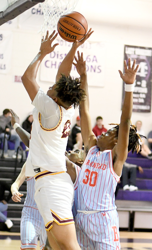 Staff Photo by Robin Rudd / Tyner's Joshua Jackson (23) shoots from under the basket. The Tyner Rams met the Brainerd Panthers in the District 4-AA tournament championship, at Marion County High School in Jasper, on February 22, 2022.