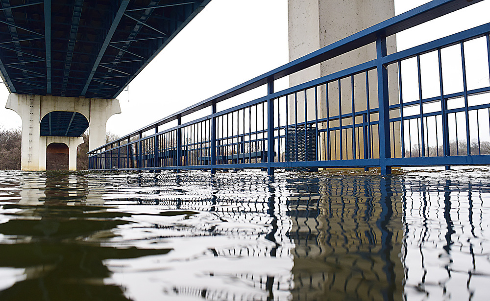 Staff Photo by Robin Rudd / The rising waters of the Tennessee River cover the surface of the Gibson Pier, under the C.B. Robinson Bridge, in the Tennessee Riverpark. The weather for Severe Weather Awareness Week has been an almost total washout as consecutive storm systems dumped rain on the Chattanooga region over the last several days. During the 48 hours from Feb. 21-23, Hamilton County got between 3.15 and 4.36 inches of rain.