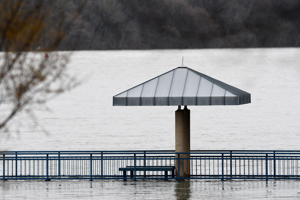 Staff Photo by Robin Rudd / A fishing pier at the Tennessee Riverpark is isolated in the floodwaters of the Tennessee River. The weather for Severe Weather Awareness Week has been an almost total washout as consecutive storm systems dumped rain on the Chattanooga region over the last several days. During the 48 hours from Feb. 21-23, Hamilton County got between 3.15 and 4.36 inches of rain.