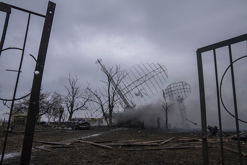 Photo by Evgeniy Maloletka of The Associated Press / Smoke rises from an air defense base in the aftermath of a Russian strike in Mariupol, Ukraine, on Feb. 24, 2022. Big explosions were heard before dawn in Kyiv, Kharkiv and Odesa as world leaders decried the start of Russian invasion that could cause massive casualties and topple Ukraine's democratically elected government.