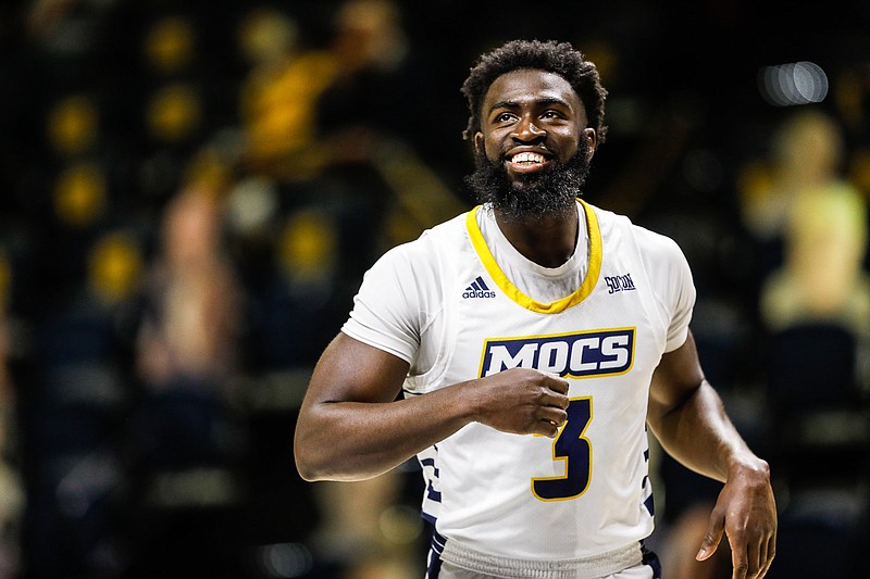 Staff photo / UTC guard David Jean-Baptiste warms up before a home game against SoCon rival East Tennessee State on Feb. 15, 2021. Jean-Baptiste had a career best with three blocks as the Mocs won 53-51.
