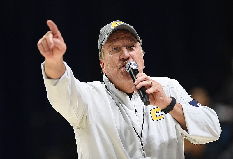 Staff photo by Matt Hamilton / Dewayne Gass, known as the Moc Maniac for 35 years, gets the crowd pumped up during the second half of Saturday's UTC men's basketball game against Samford at McKenzie Arena.