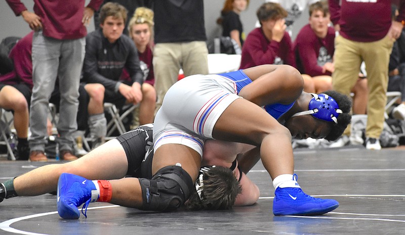 Staff file photo by Patrick MacCoon / Cleveland senior Tetoe Boyd, top, won his second straight TSSAA individual wrestling championship Saturday at th Williamson Ag Expo Center in Franklin.