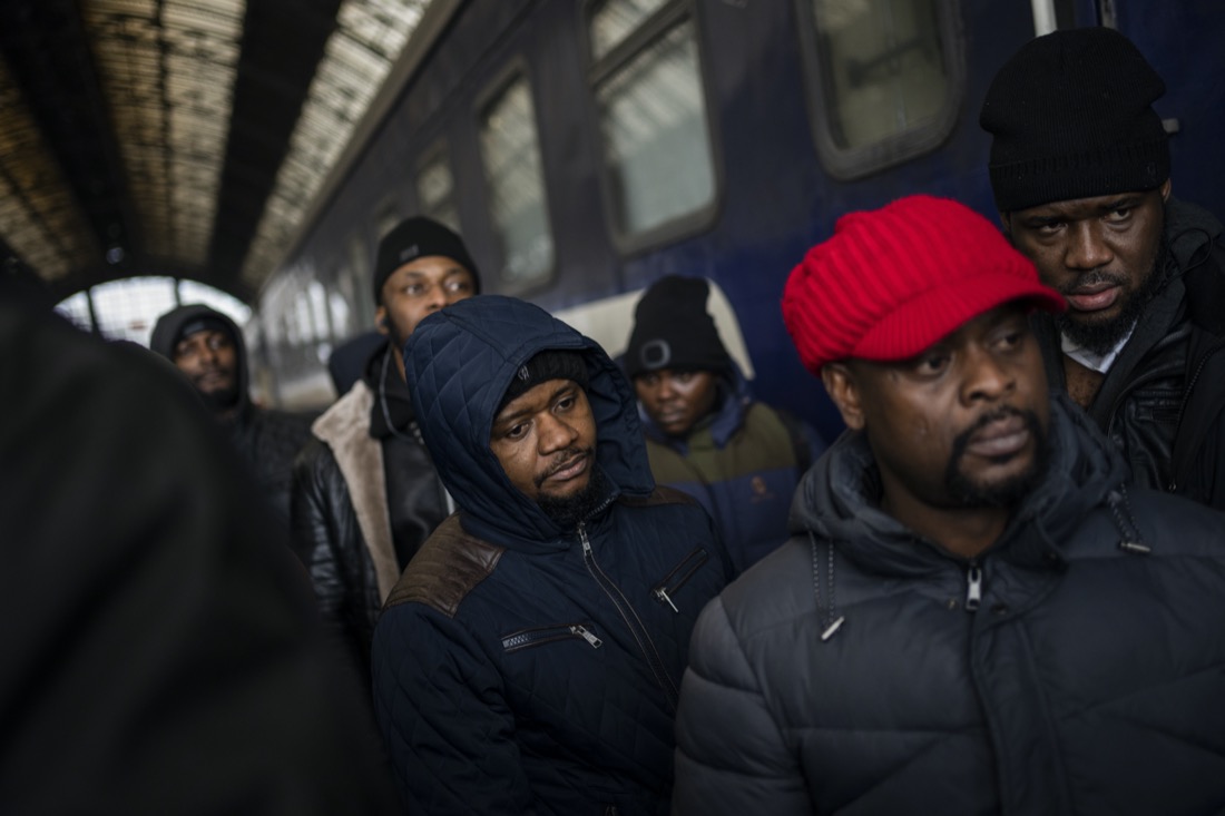 African residents in Ukraine wait at the platform inside Lviv railway station, Sunday, Feb. 27, 2022, in Lviv, west Ukraine. Thousands of people massed at Lviv's main train station on Sunday, attempting to board trains that would take them out of Ukraine and into the safety of Europe as the Russian invasion of that country continued. (AP Photo/Bernat Armangue)