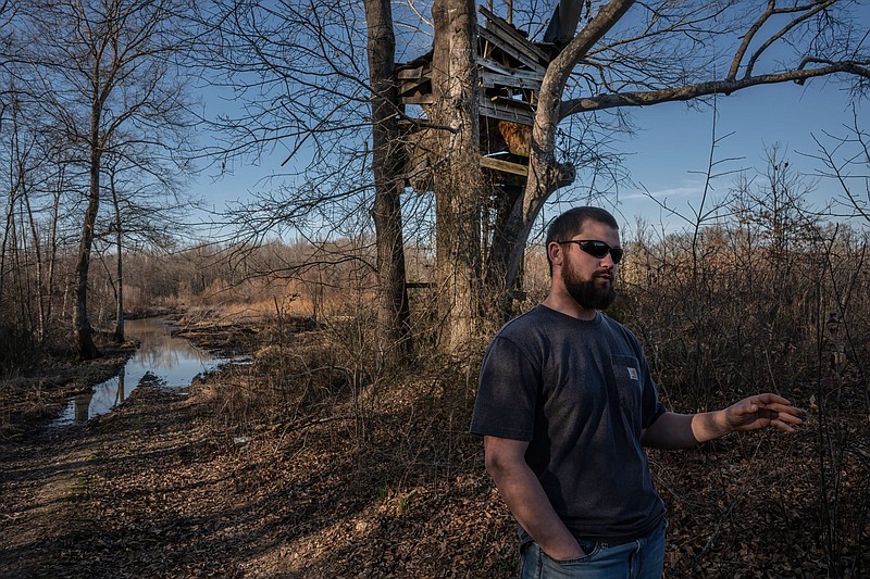 Hunter Hollingsworth points out the area in which he found a camera installed by the Tennessee Wildlife Resources Agency. /Photo by John Partipilo/Tennessee Lookout