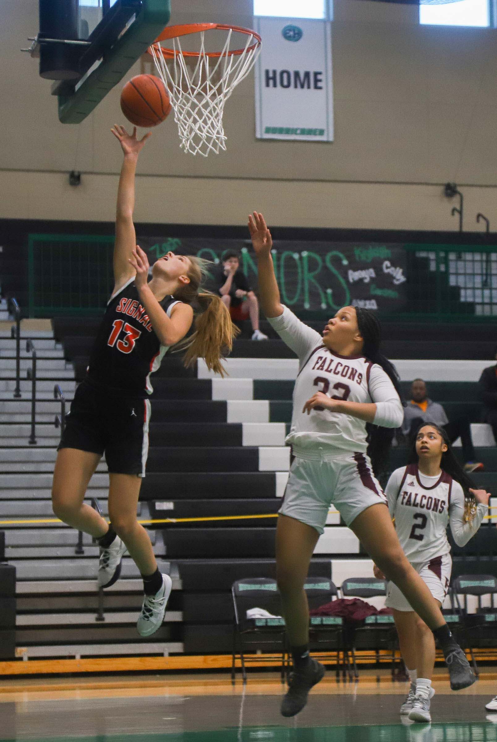 Photo by Olivia Ross / Carlee Lowry (13) attempts a layup. Signal Mountain took on Knoxville Fulton in the Region 3-3A semifinal game.