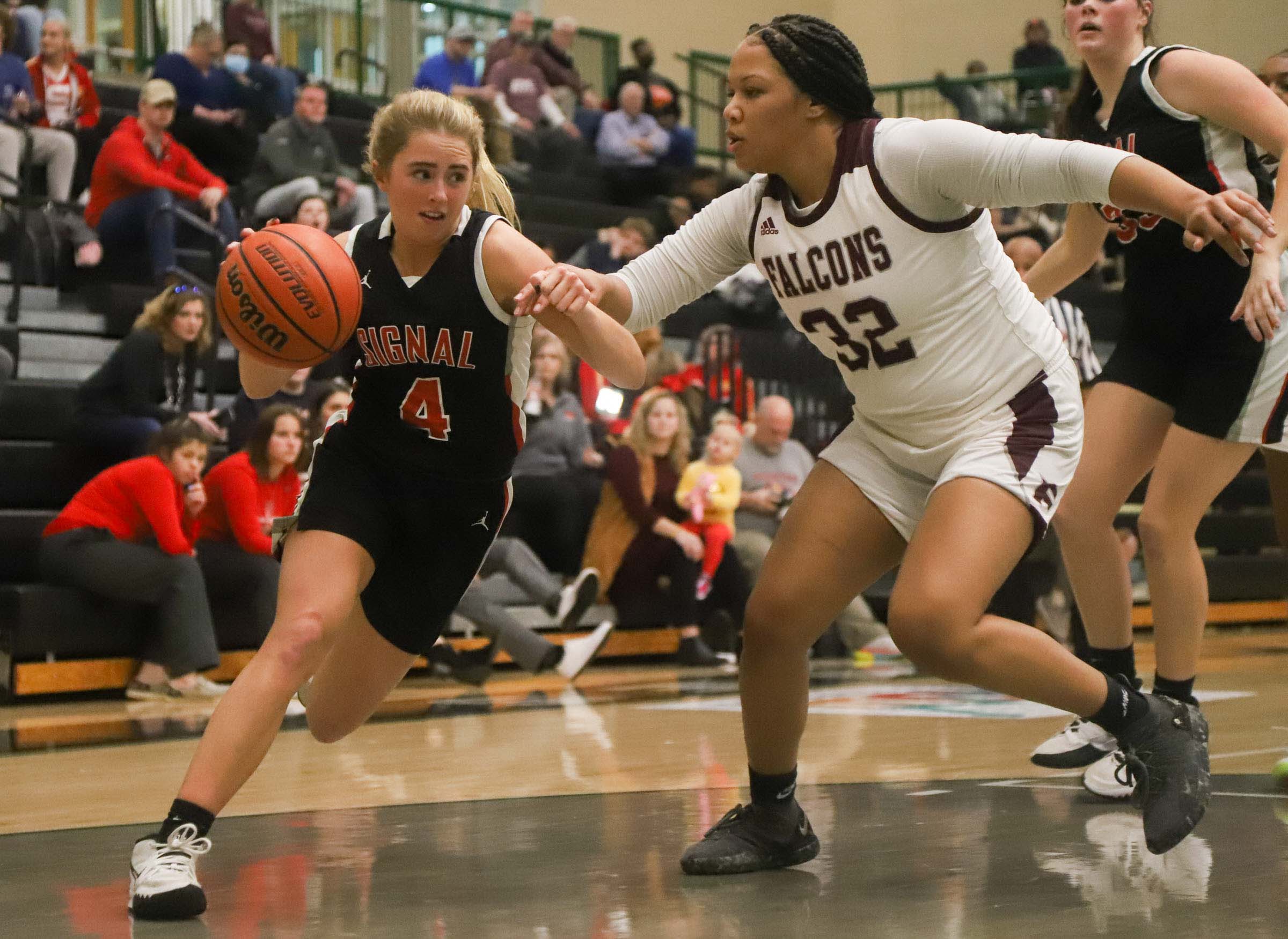 Photo by Olivia Ross / Megan Clark (4) dribbles around her defender. Signal Mountain took on Knoxville Fulton in the Region 3-3A semifinal game.
