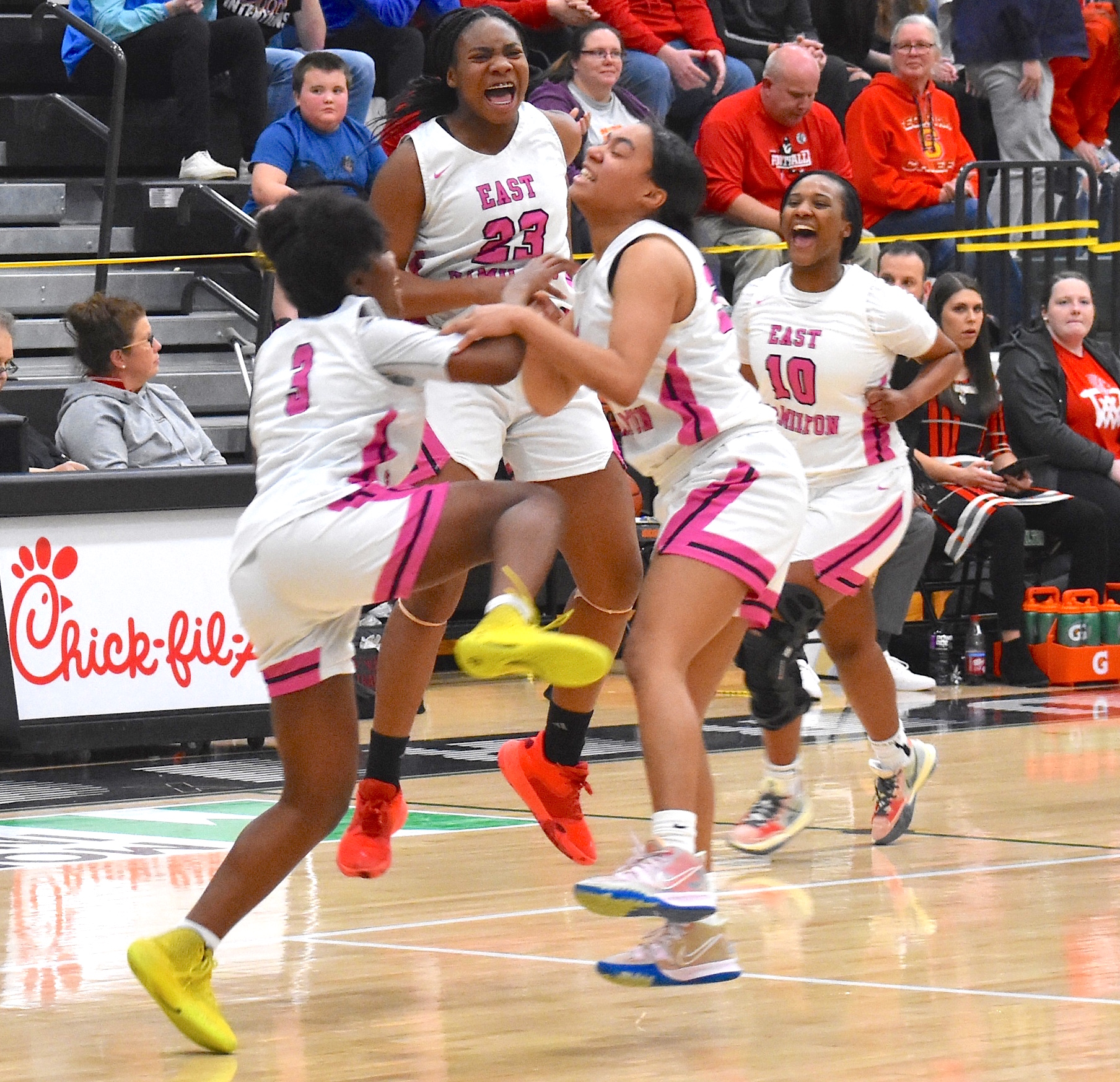 Staff photo by Patrick MacCoon / East Hamilton players celebrate their 46-43 Region 3-AAA semifinals victory at home over Sequoyah on Monday night. Lady Hurricanes from left, Tristin Sutton (1), Morgan Bone (23), Amya Sutton (25) and Niya McGhee (10).