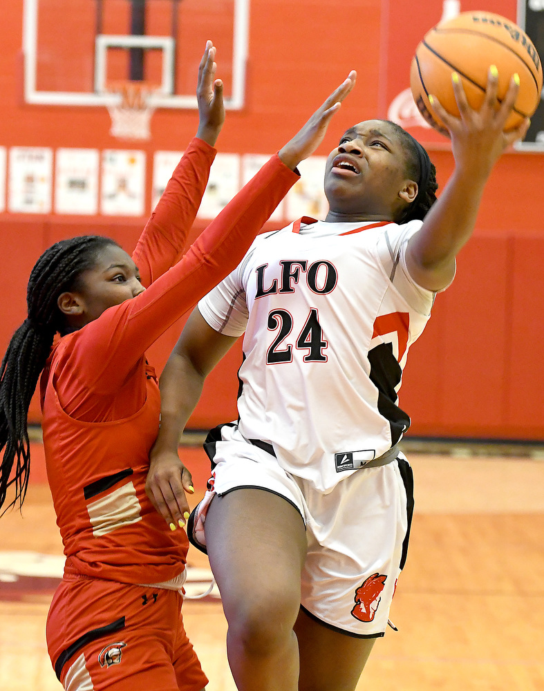 Staff Photo by Robin Rudd / Lakeview's Christina Collins (24) drives to the basket and is fouled. The Lakeview Fort Oglethorpe Lady Warriors fell to the Greater Atlanta Christian School Lady Spartans, 67 to 60, in the quarterfinals of the GHSA state tournament on March 1, 2022.