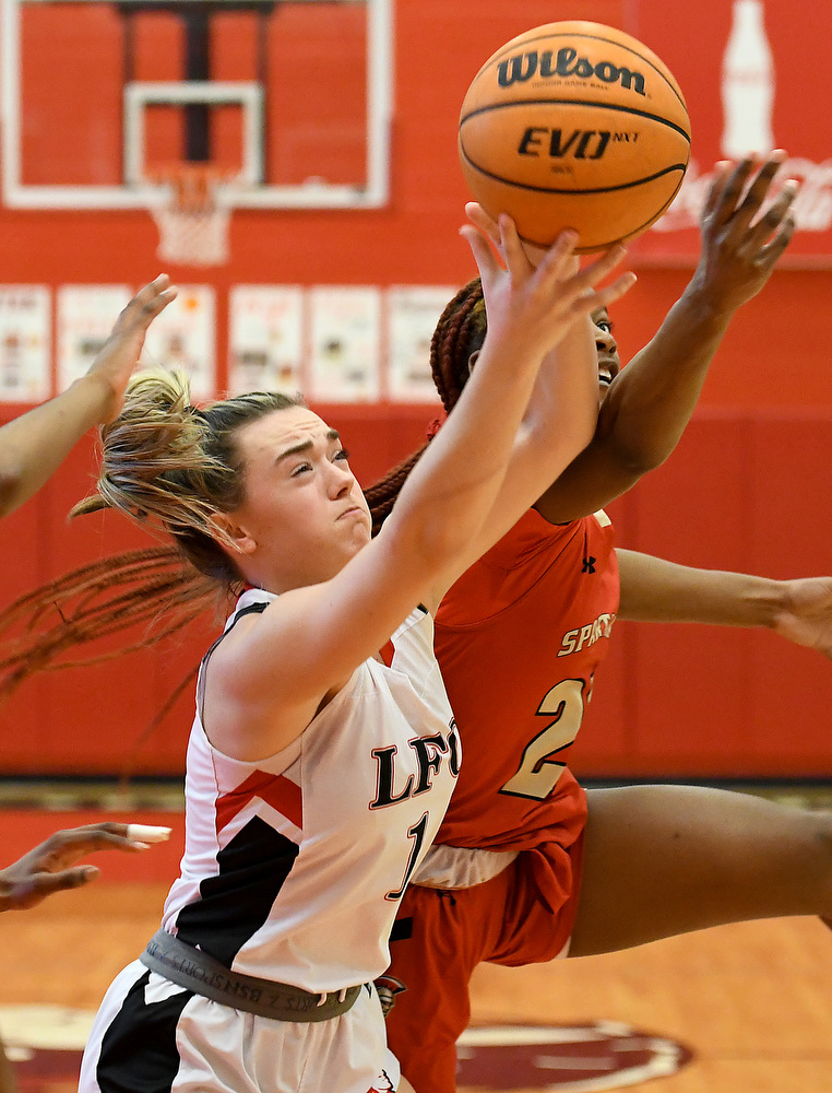 Staff Photo by Robin Rudd / Lakeview's Gracie Cochran (1) battles a GAC player for a rebound. The Lakeview Fort Oglethorpe Lady Warriors fell to the Greater Atlanta Christian School Lady Spartans, 67 to 60, in the quarterfinals of the GHSA state tournament on March 1, 2022.