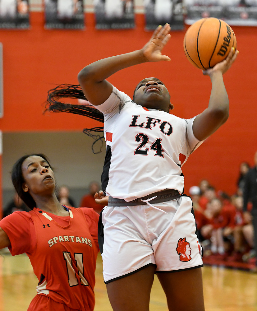 Staff Photo by Robin Rudd / Lakeview's Christina Collins (24) gets inside for the score. The Lakeview Fort Oglethorpe Lady Warriors fell to the Greater Atlanta Christian School Lady Spartans, 67 to 60, in the quarterfinals of the GHSA state tournament on March 1, 2022.