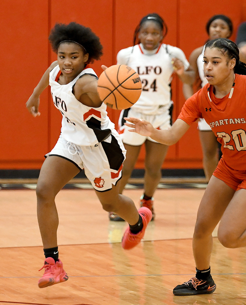 Staff Photo by Robin Rudd / Angel Simmons (30) gets to a loose ball before a GAC player. The Lakeview Fort Oglethorpe Lady Warriors fell to the Greater Atlanta Christian School Lady Spartans, 67 to 60, in the quarterfinals of the GHSA state tournament on March 1, 2022.