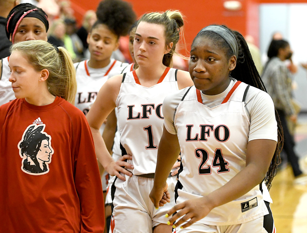 Staff Photo by Robin Rudd / Christina Collins (24) and the rest of the Lady Warriors leave the floor at the end of the game. The Lakeview Fort Oglethorpe Lady Warriors fell to the Greater Atlanta Christian School Lady Spartans, 67 to 60, in the quarterfinals of the GHSA state tournament on March 1, 2022.
