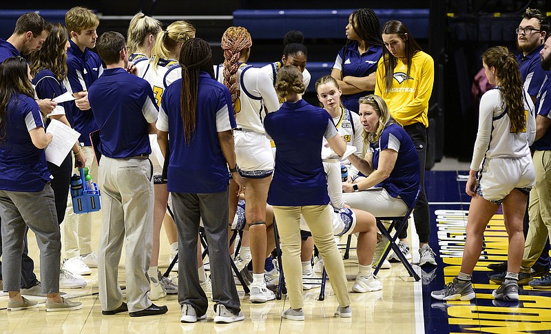 Staff photo by Robin Rudd / UTC women's basketball coach Katie Burrows talks to her team during a timeout in a home game against SoCon foe Western Carolina on Jan. 20. The Mocs won 55-48 that day but finished the regular season 7-22 overall and 5-9 in the conference.