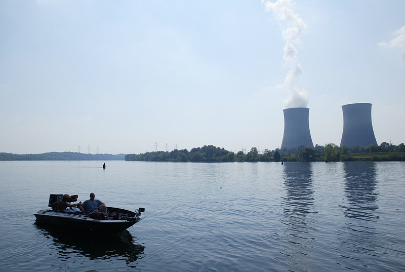 Staff file photo / A couple of unidentified fishermen relax as their boat idles near the Watts Bar Nuclear Plant near Spring City, Tennessee.