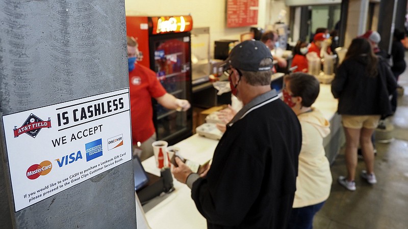 Staff photo / A sign next to a concession window informs fans that AT&T Field is not accepting cash on opening day for the Chattanooga Lookouts on May 4, 2021.