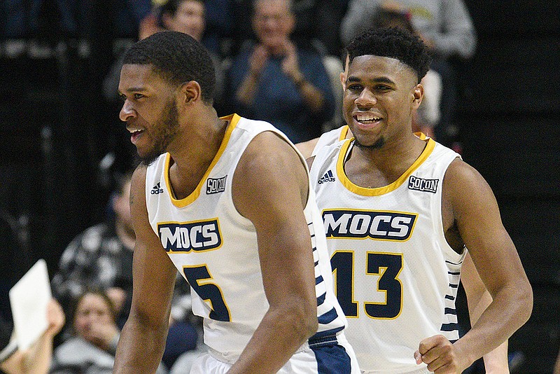 Staff photo by Matt Hamilton / UTC's Darius Banks, left, and Malachi Smith celebrate after a score during the Mocs' 71-60 win against Wofford on Jan. 26 at McKenzie Arena. Banks and Smith, who are roommates, hope to help lead the SoCon regular-season champions to a sweep of the conference titles by winning the league tournament in Asheville, N.C.