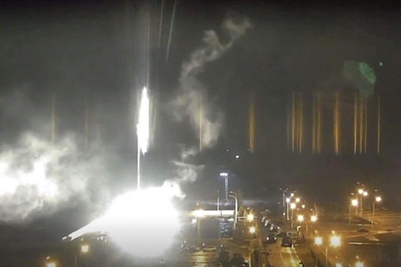 This image made from a video released by Zaporizhzhia nuclear power plant shows bright flaring object landing in grounds of the nuclear plant in Enerhodar, Ukraine Friday, March 4, 2022. Russian forces shelled Europe's largest nuclear plant early Friday, sparking a fire as they pressed their attack on a crucial energy-producing Ukrainian city and gained ground in their bid to cut off the country from the sea. (Zaporizhzhia nuclear power plant via AP)