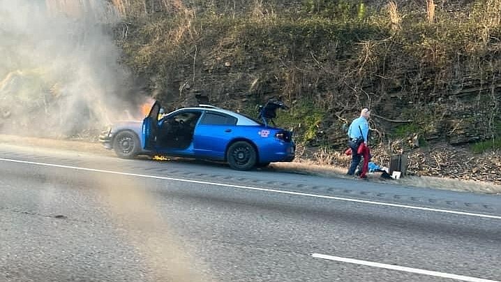 Photo by William Thompson / A Georgia State Patrol cruiser caught fire Friday morning, stopping traffic along Interstate 75 in Catoosa County.	