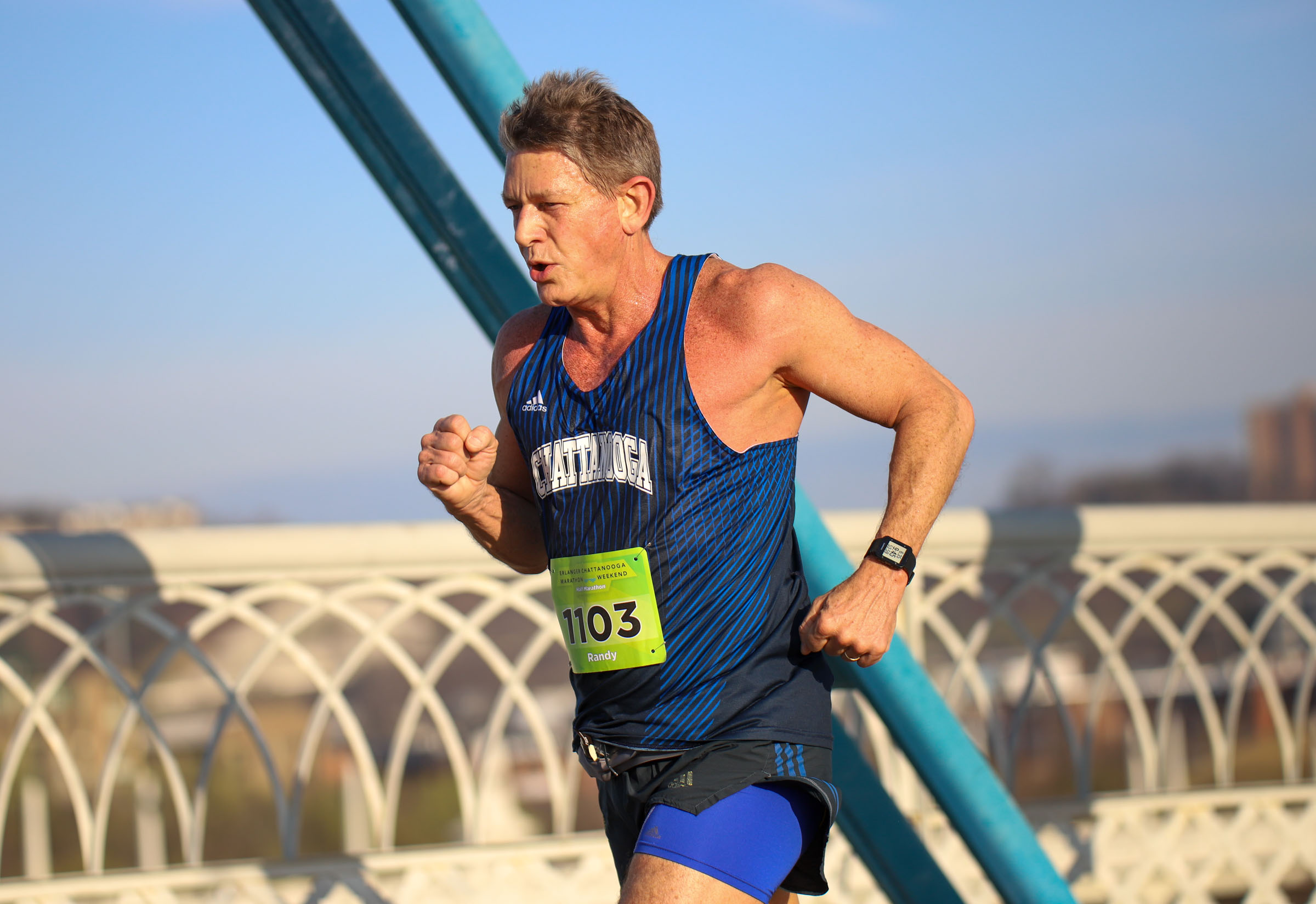 Staff Photo by Olivia Ross / Randy Boyd, UT President, runs across the Walnut Street Bridge on March 6, 2022. The Erlanger Chattanooga Marathon is a full weekend complete with a marathon, half marathon, relays, 5k, and kid's fun run.