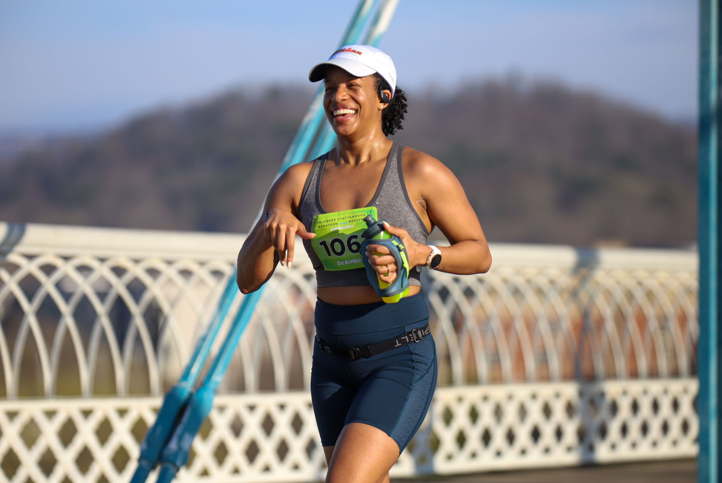 Staff Photo by Olivia Ross / DeAmber Stewart smiles as she runs across the Walnut Street Bridge on March 6, 2022. The Erlanger Chattanooga Marathon is a full weekend complete with a marathon, half marathon, relays, 5k, and kid's fun run.