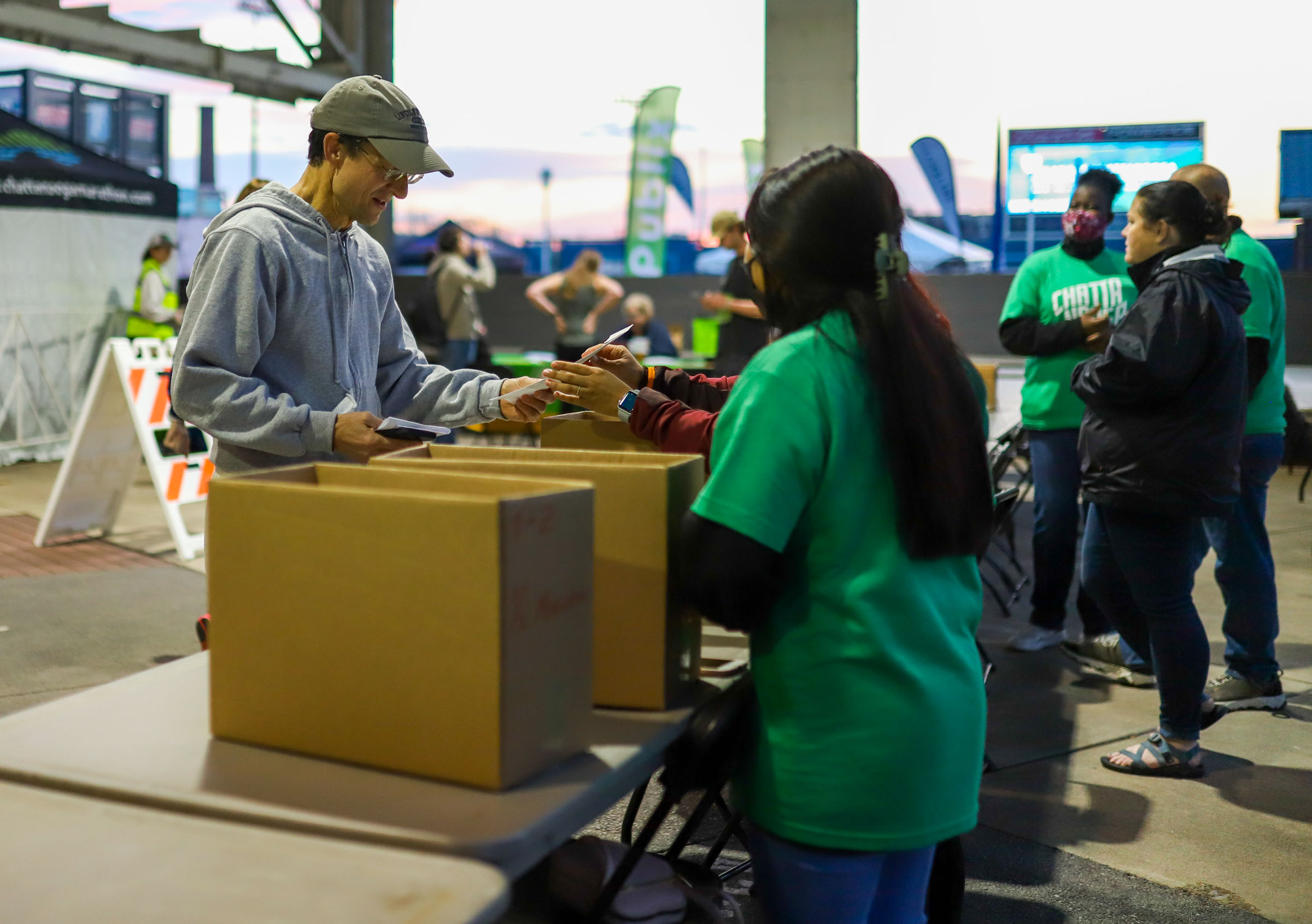 Staff Photo by Olivia Ross / Runners check in at the registration desk early on March 6, 2022. The Erlanger Chattanooga Marathon is a full weekend complete with a marathon, half marathon, relays, 5k, and kid's fun run.