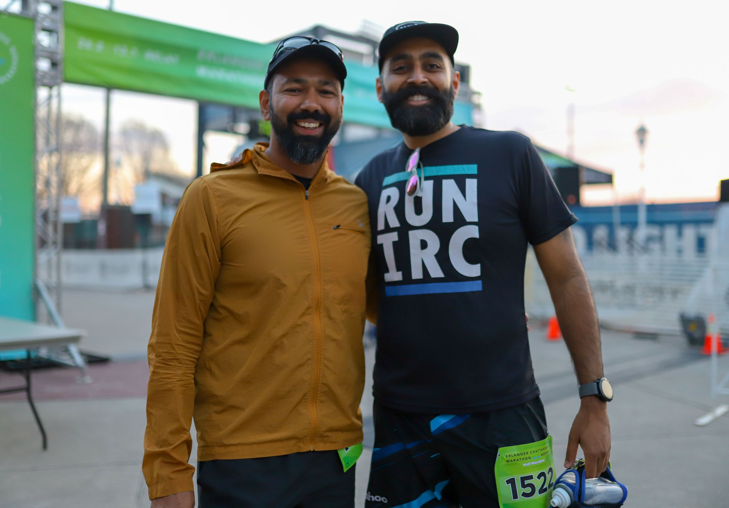 Staff Photo by Olivia Ross / Yawar Siddiqui and Abbas Naqvi smile while waiting for the race to begin on March 6, 2022. The Erlanger Chattanooga Marathon is a full weekend complete with a marathon, half marathon, relays, 5k, and kid's fun run.
