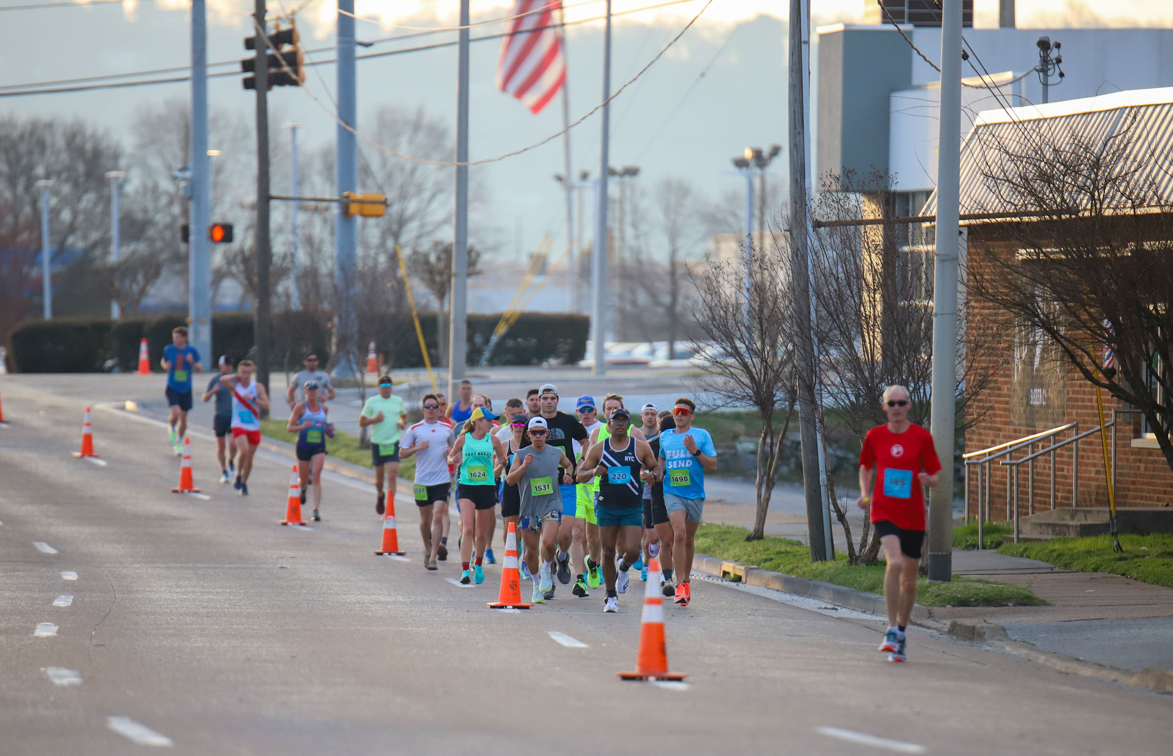 Staff Photo by Olivia Ross / Runners make their way down W 20th Street on March 6, 2022. The Erlanger Chattanooga Marathon is a full weekend complete with a marathon, half marathon, relays, 5k, and kid's fun run.